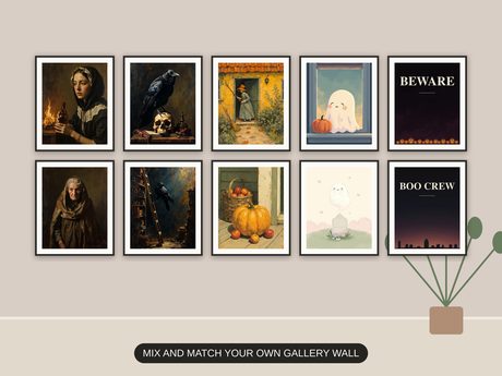 Ten Halloween prints from the bundle framed together as a gallery wall above a console table