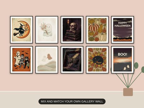 Ten Halloween prints from the bundle framed together as a spooky gallery wall above a console table